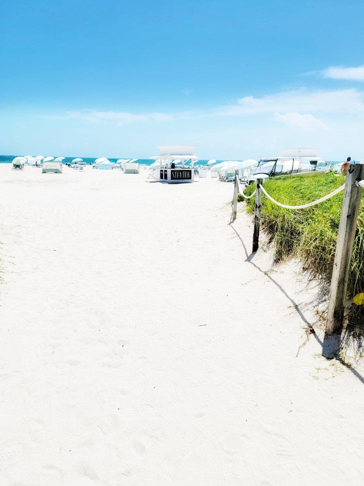 White umbrellas on the private beach